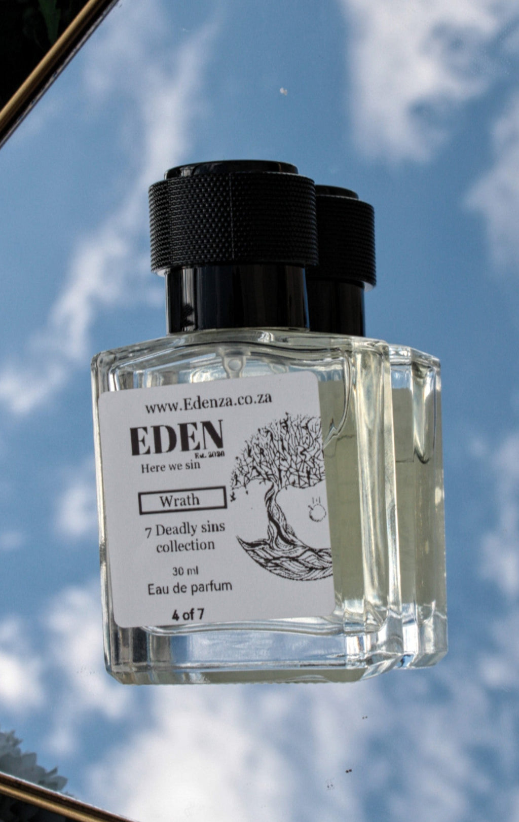 Eden perfume bottle with a blue sky background